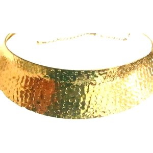 Hammered style choker necklace. Gold colored
